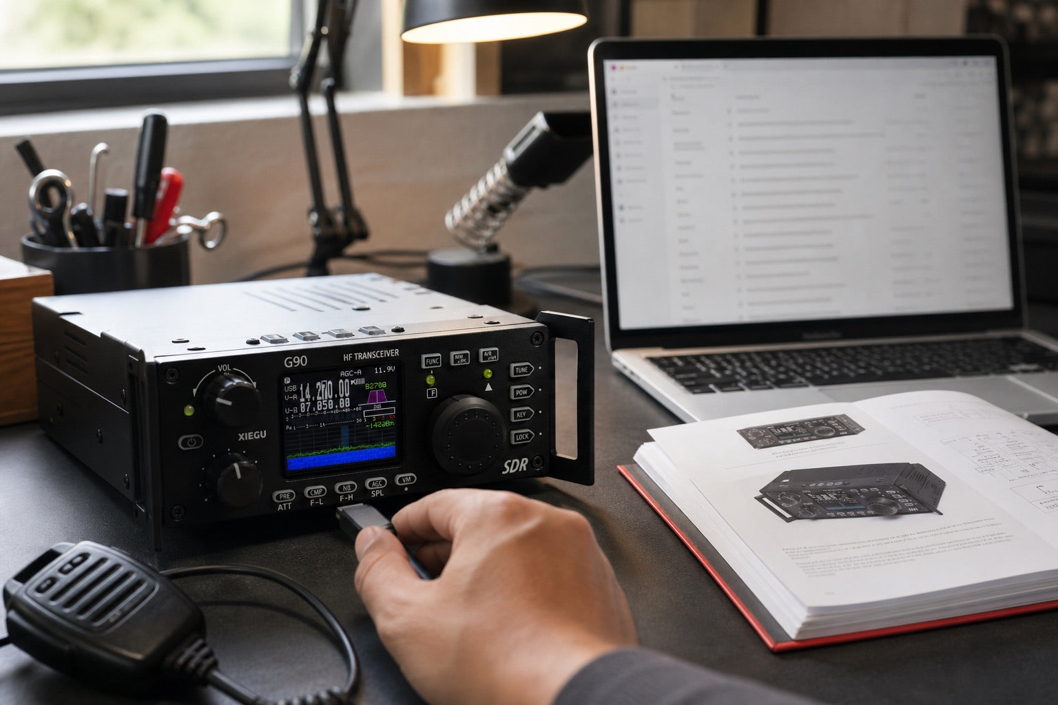 Xiegu G90 being connected beside a manual and support email